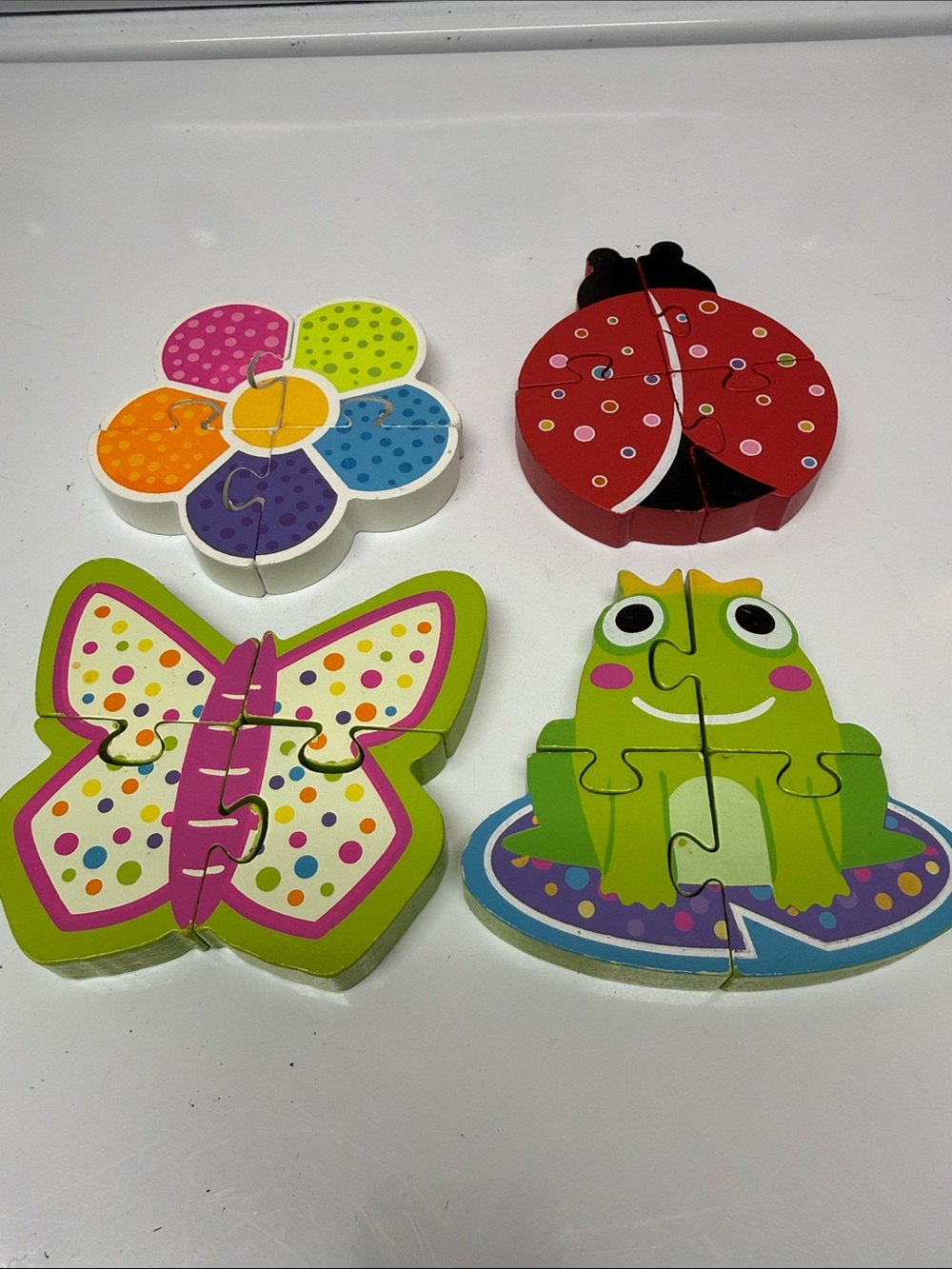Set of 4 painted wooden puzzles